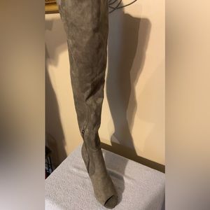 Thigh high peep toe heel boots very sleek and sexy.